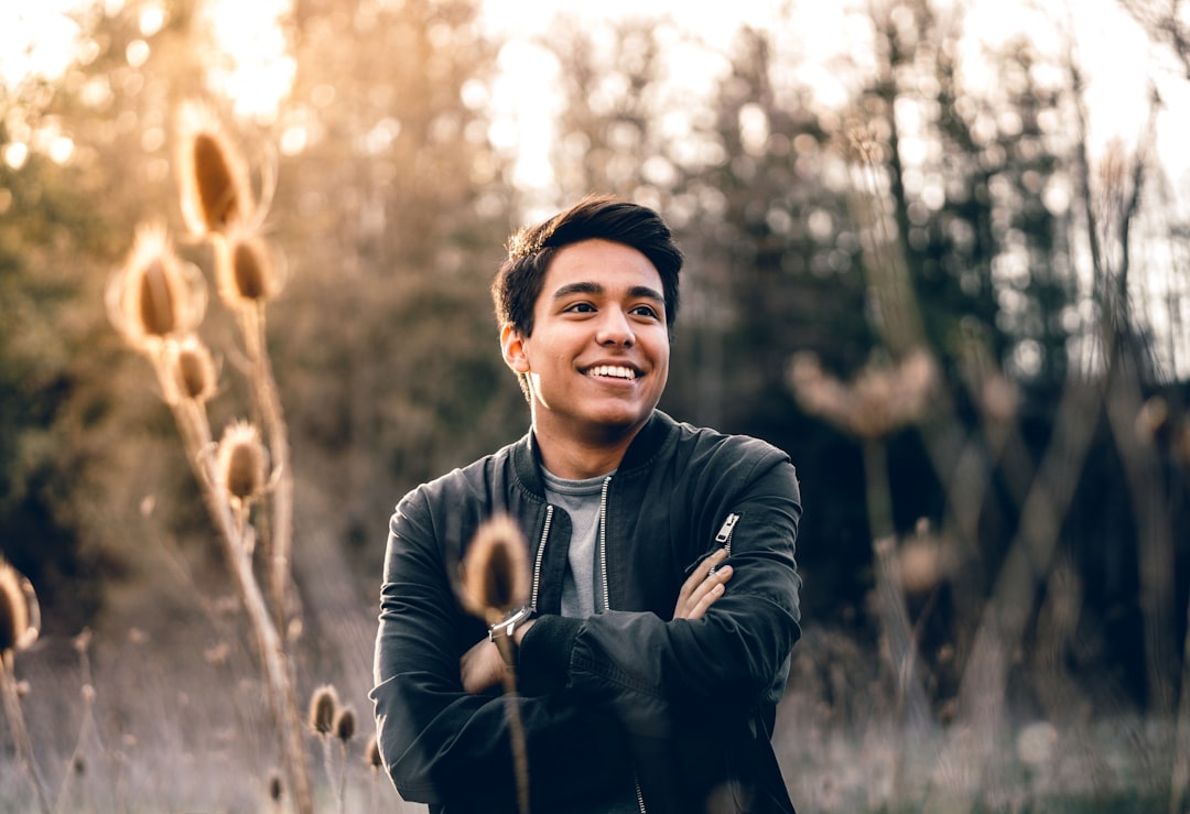 Approachable adult man in a natural outdoor portrait