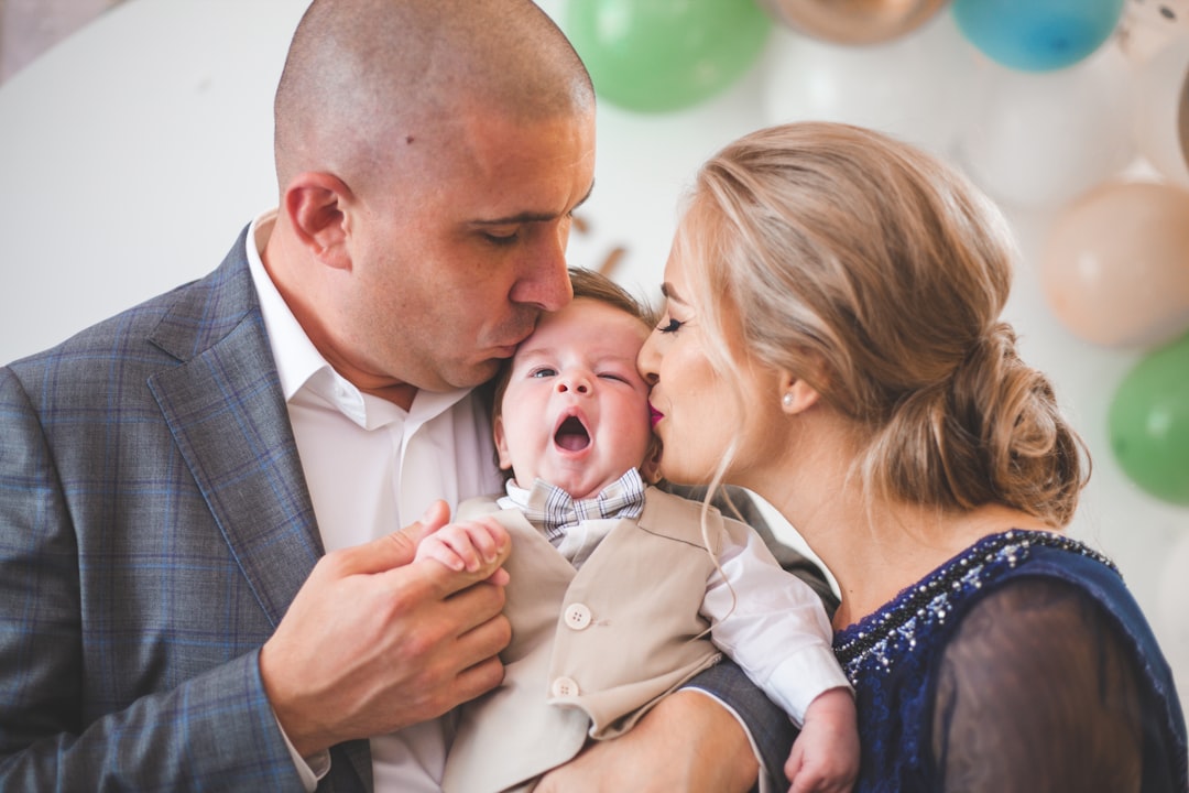 Happy baby with parents at home