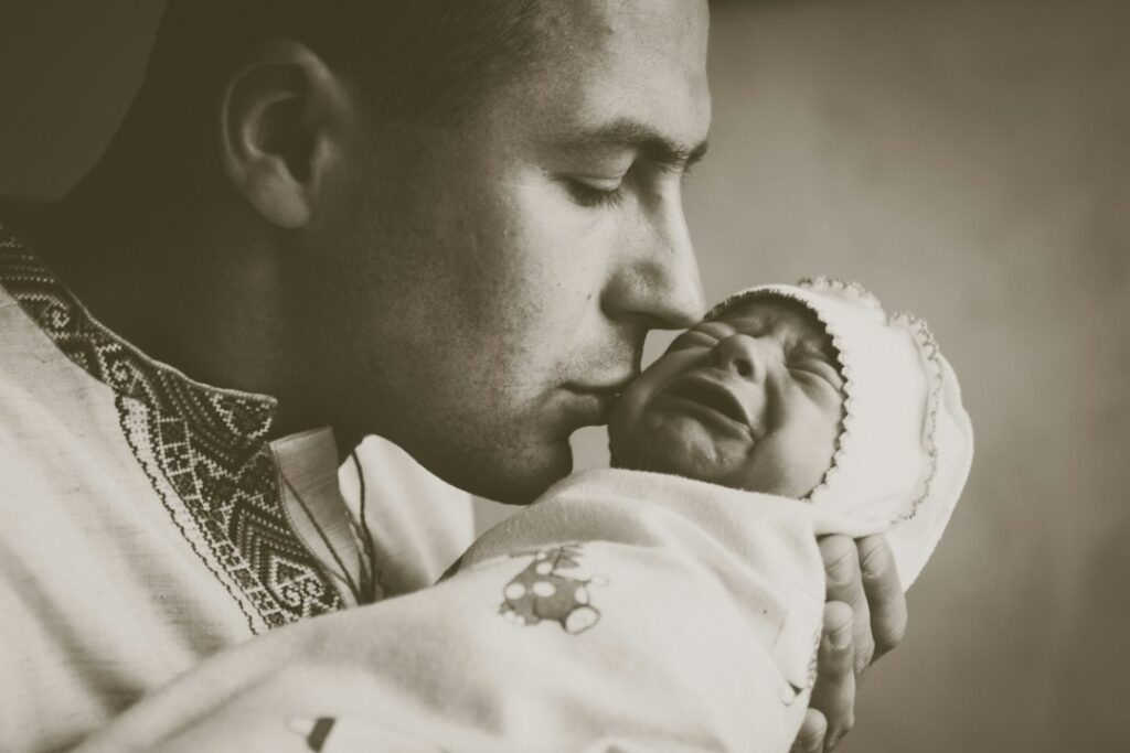 Father holding his baby in a warm family setting