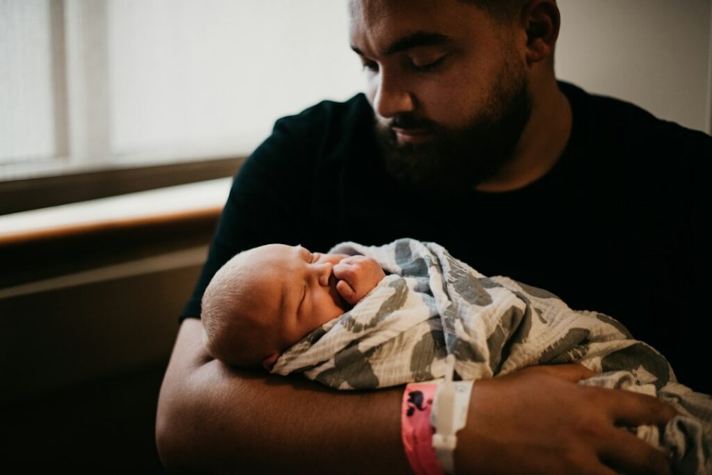 Father holding his newborn son