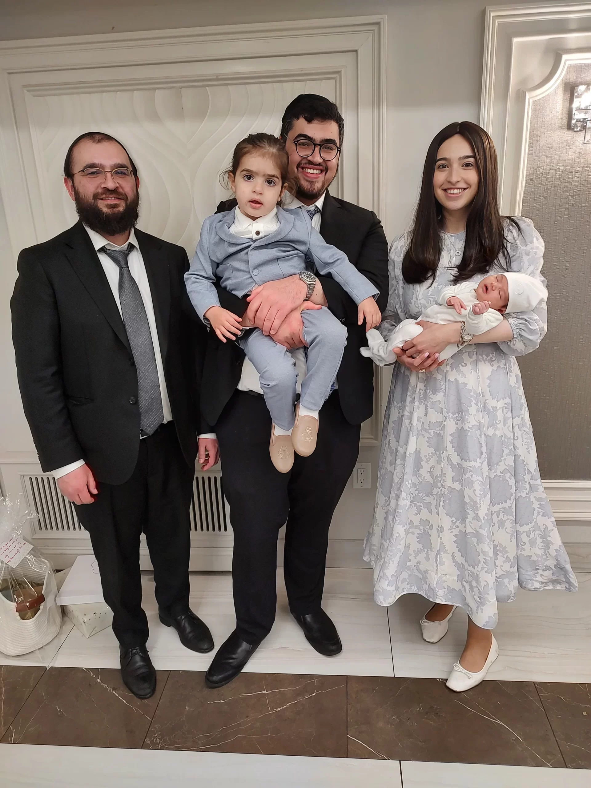 Family and baby after a circumcision visit